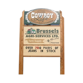 Brussels Agri Services Ltd. storefront sign promoting farm supply products and jeans in stock