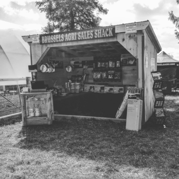 Historic Brussels Agri Sales Shack showcasing farm supply products in the early days of the business