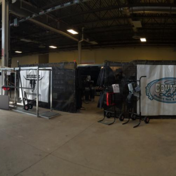 Indoor display of farm and livestock supplies at Brussels Agri Services, including tack, feed, and equipment